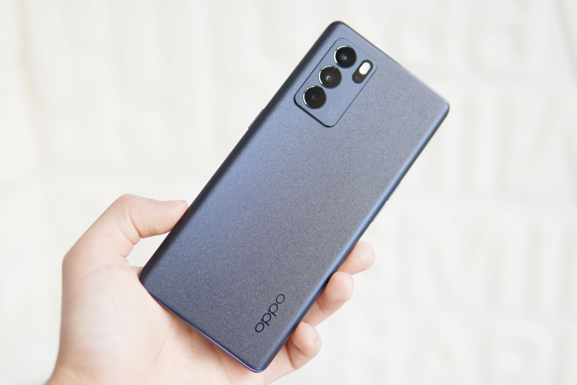 Close-up of a modern smartphone held in a hand showing sleek design.