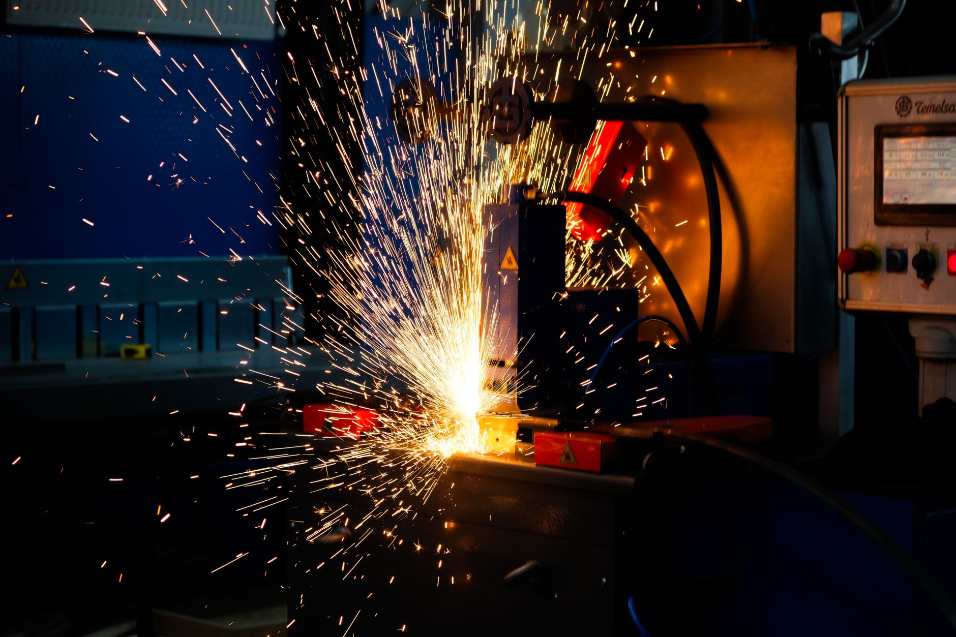 Vibrant display of welding sparks in an industrial setting, highlighting manufacturing processes.