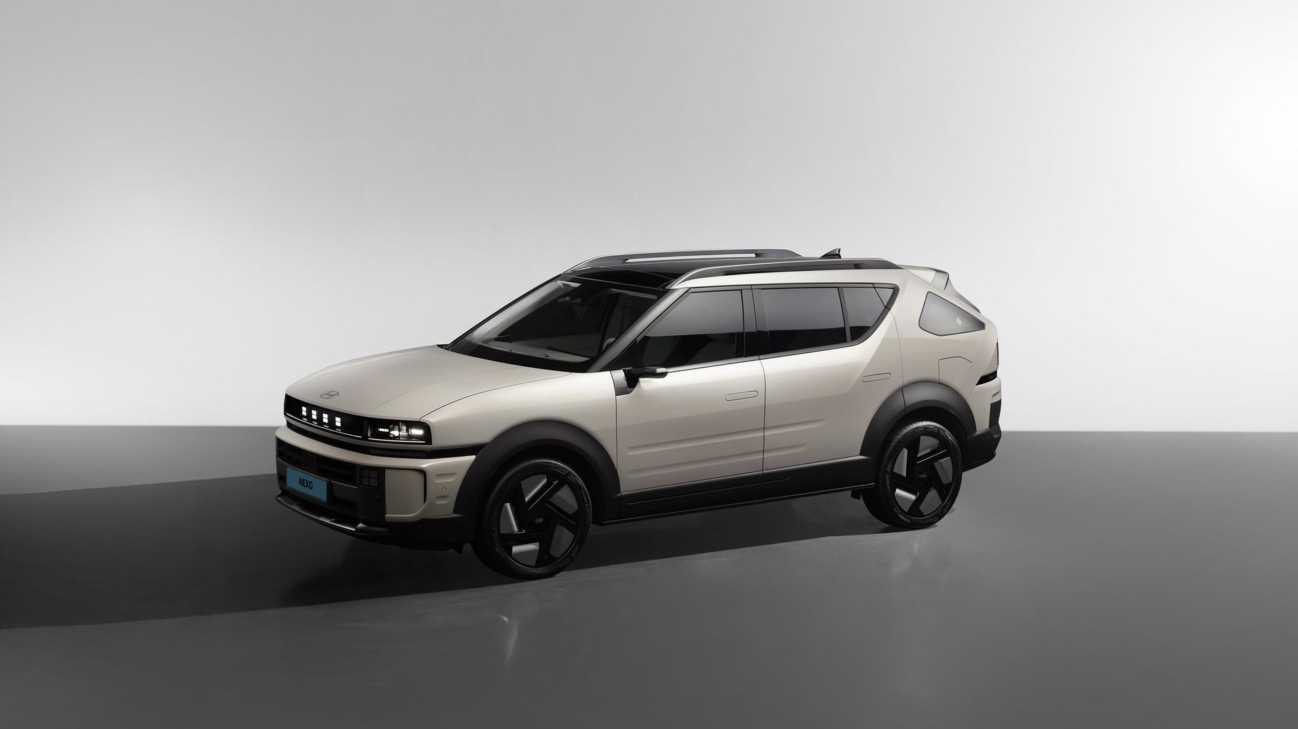 Sleek Hyundai Nexo FCEV showcased in a modern studio with elegant lighting.