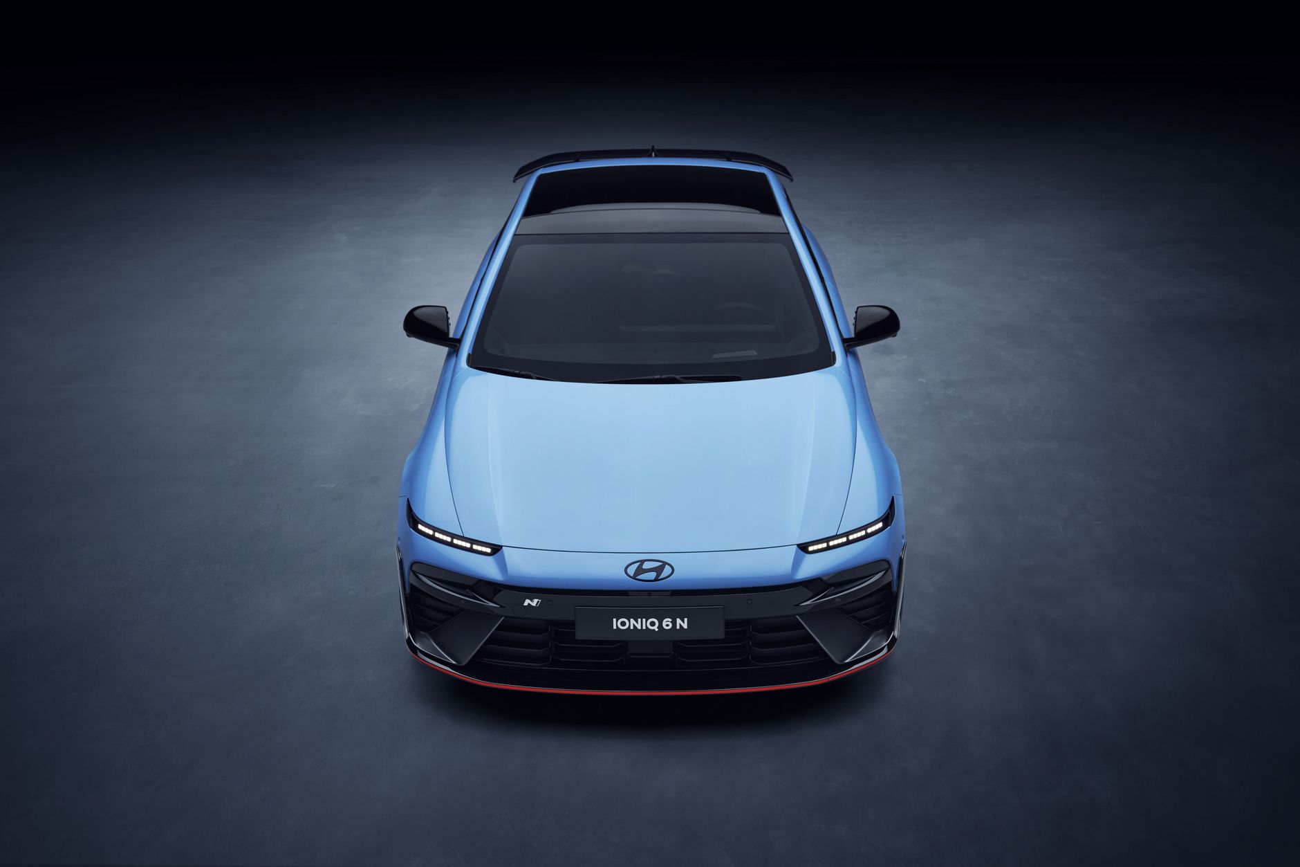 Front view of the Hyundai Ioniq 6 N electric vehicle with sophisticated design and lighting.