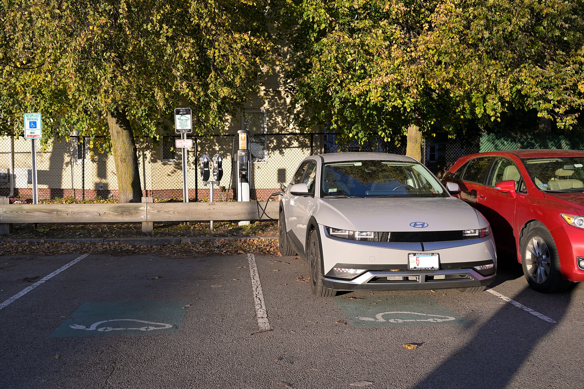 A Hyundai Ioniq 5 charges at a ChargePoint station next to the Somerville Community Path in Davis Square