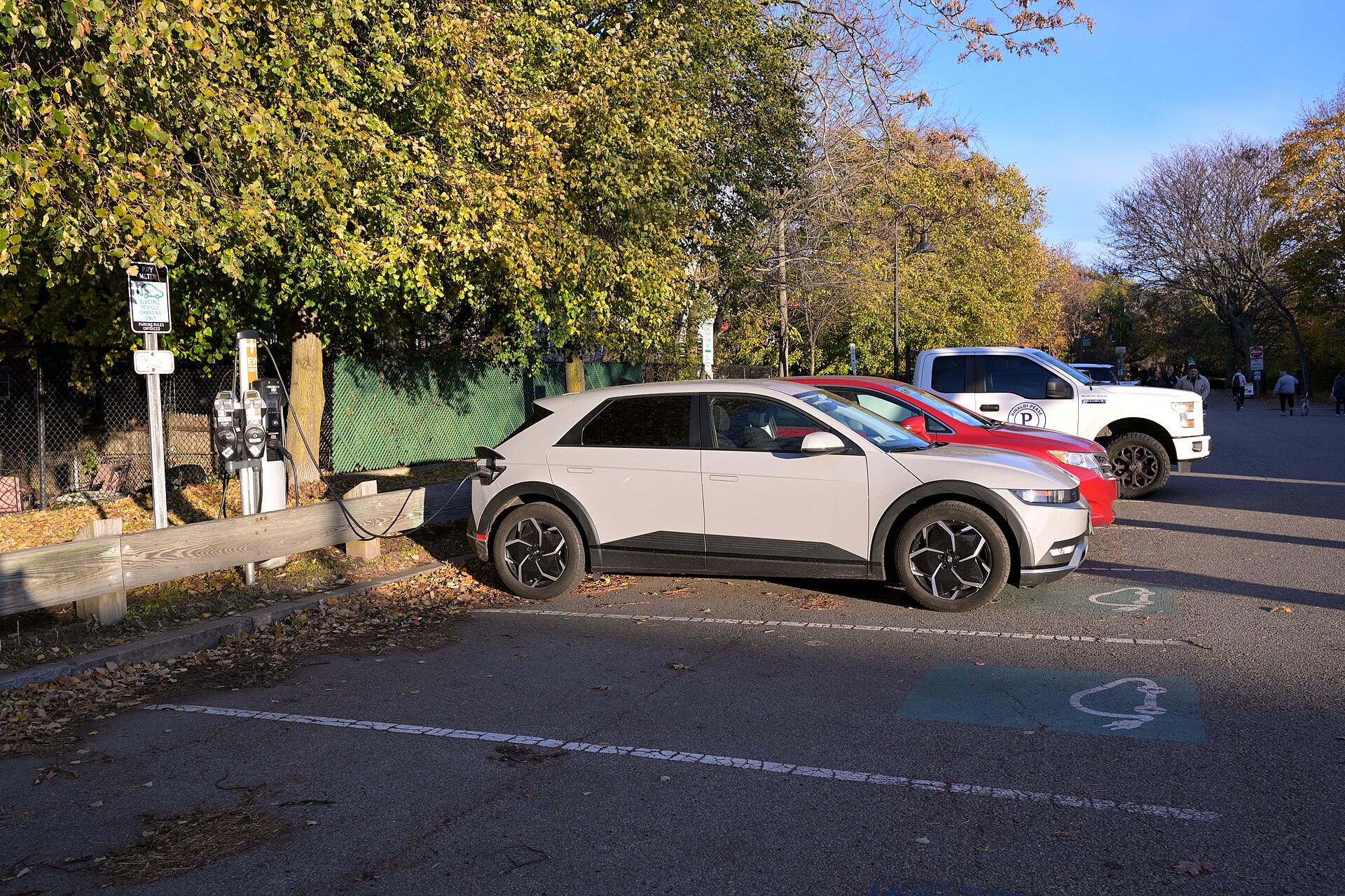 A Hyundai Ioniq 5 charges at a ChargePoint station next to the Somerville Community Path in Davis Square