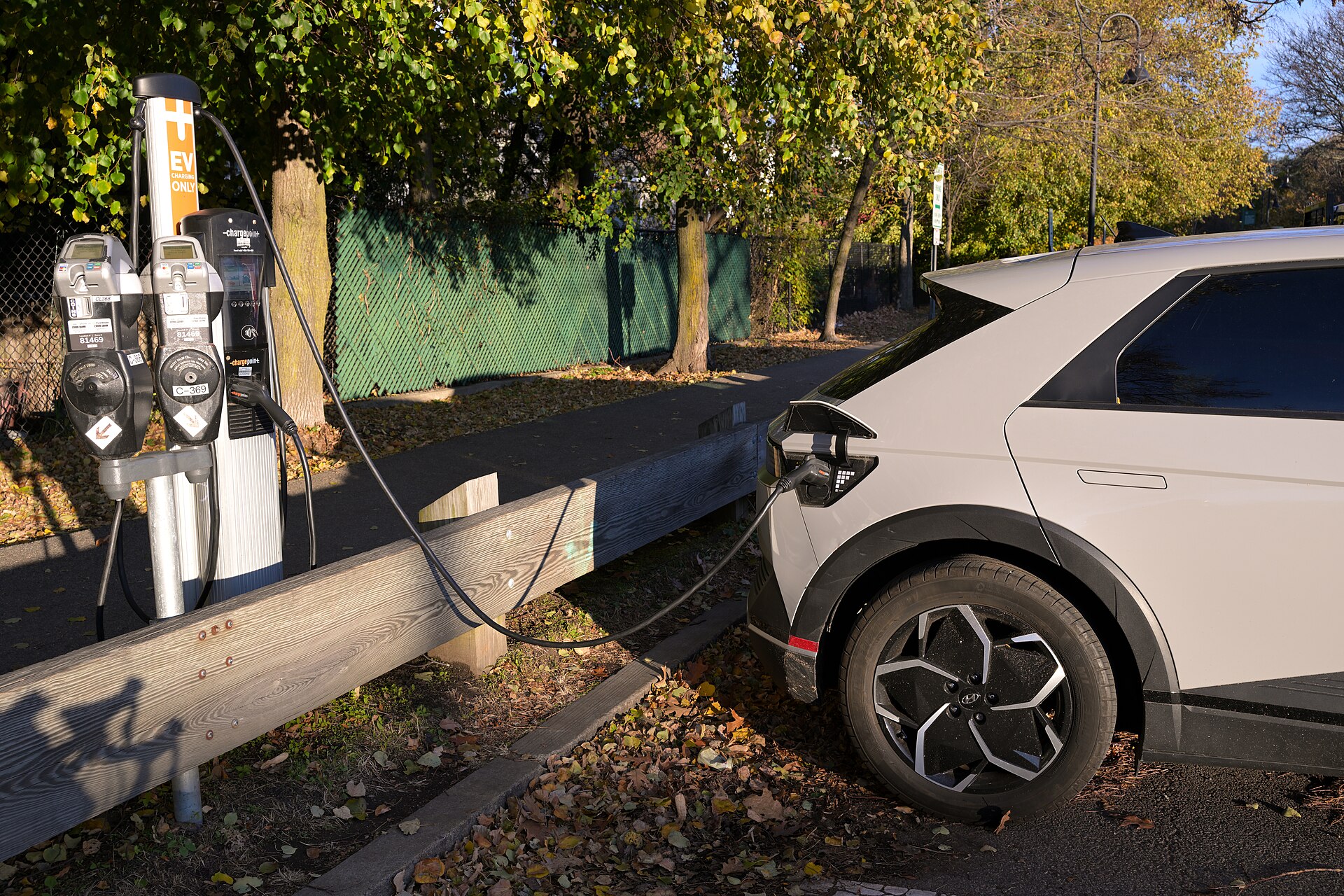A Hyundai Ioniq 5 charges at a ChargePoint station next to the Somerville Community Path in Davis Square